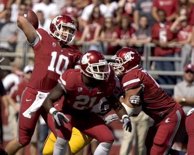 WSU’s offense took a step forward by putting  QB Jeff Tuel in charge.  (Associated Press)