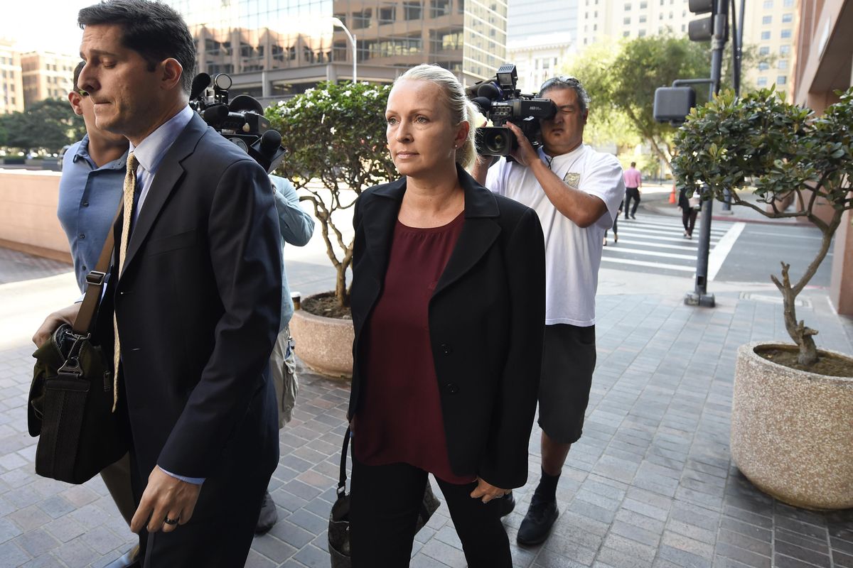 Margaret Hunter, center, the wife of U.S. Rep. Duncan Hunter, arrives for an arraignment hearing Thursday, Aug. 23, 2018, in San Diego. Hunter and his wife were indicted this week on federal charges that they used more than $250,000 in campaign funds for personal expenses that ranged from groceries to golf trips and lied about it in federal filings, prosecutors said. (Denis Poroy / AP)