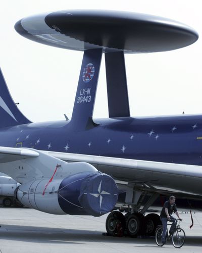A NATO AWACS plane is seen on the tarmac at the NATO base in Geilenkirchen, Germany. NATO will launch 24-hour air surveillance of Libya. (Associated Press)