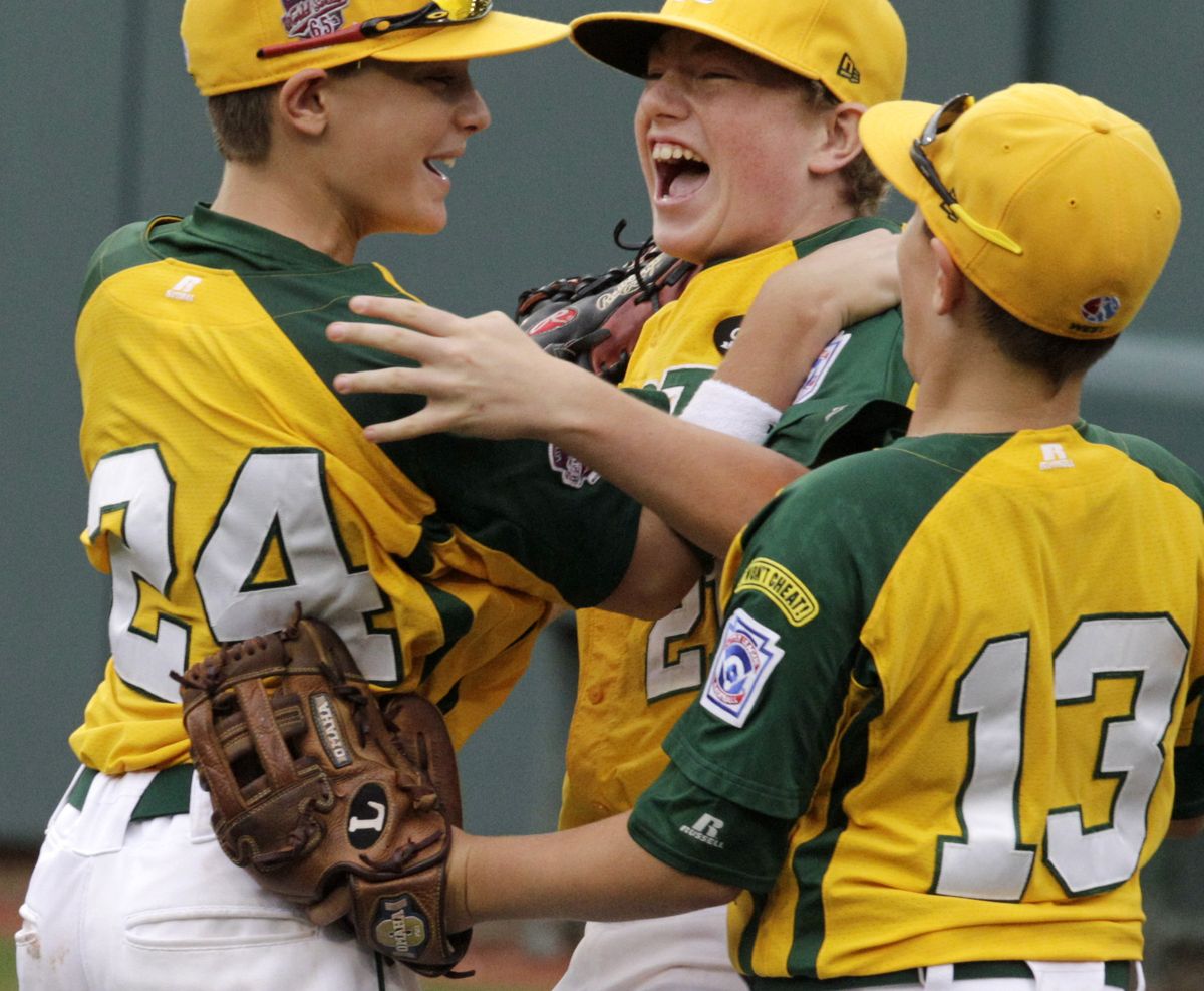 California’s Hagen Danner, left, and Dylan Palmer, right, congratulate pitcher Trevor Windisch. (Associated Press)