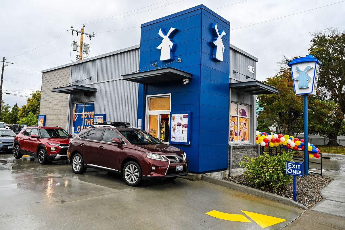 Customers return to Dutch Bros Coffee stand for the first time on Wednesday, Sept. 27, 2023, after a dump truck crashed into the building on South Freya Street, Aug. 20, 2021, in Spokane.  (DAN PELLE/THE SPOKESMAN-REVIEW)
