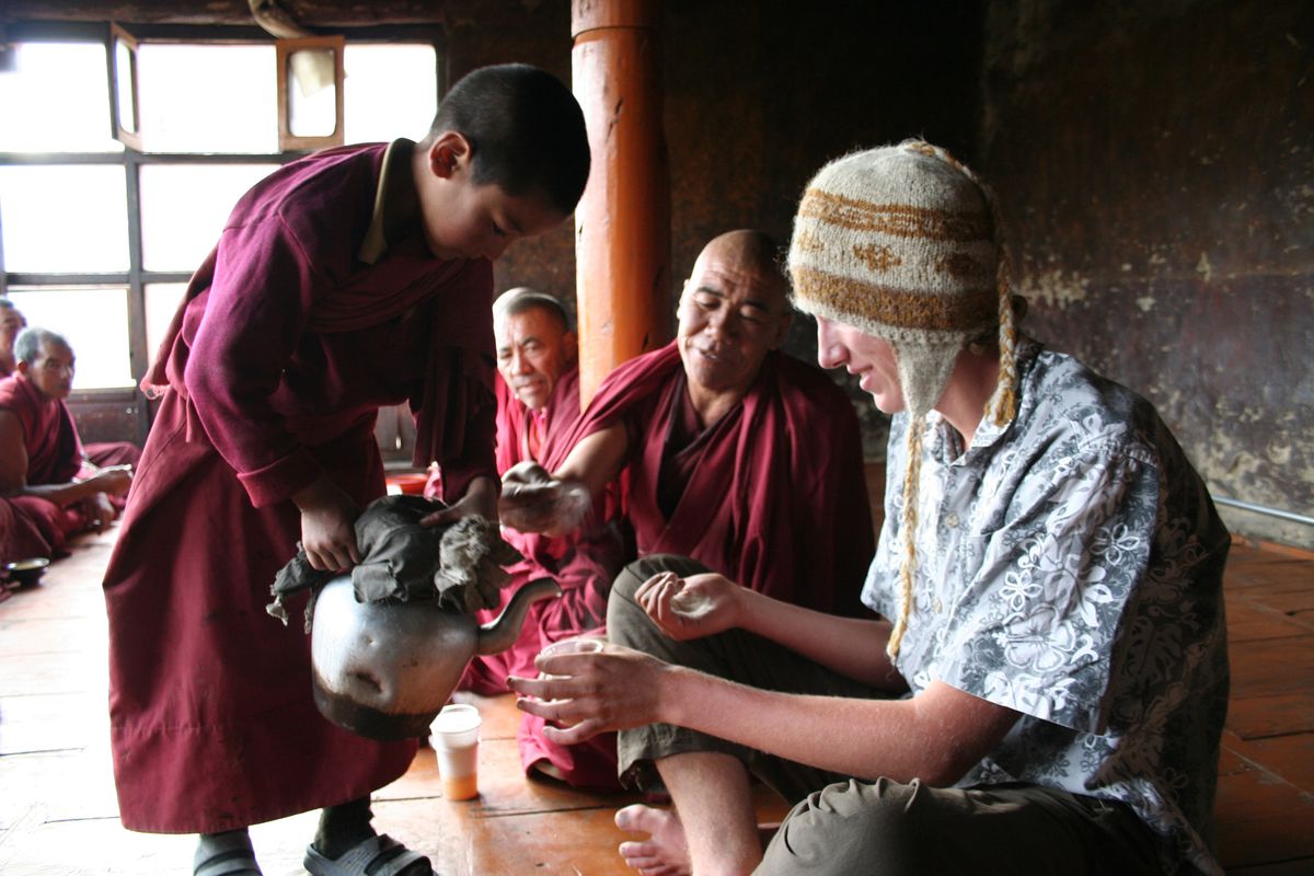 Nick Ivers of Spokane has tea with monastery monks on a 2008 group trek, including Gerry Copeland, through northern India’s Ladakh region.Courtesy of Gerry Copeland (Courtesy of Gerry Copeland / The Spokesman-Review)