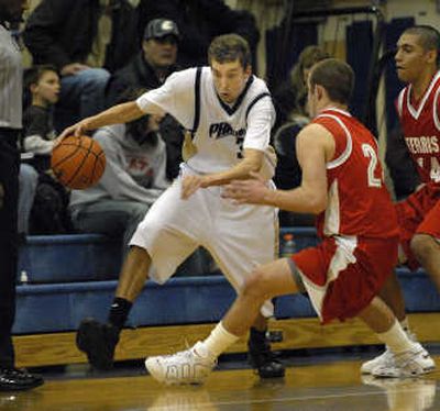 
Mead's Brendan Ingebritsen drives against Ferris defenders earlier this week. 
 (Brian Plonka / The Spokesman-Review)