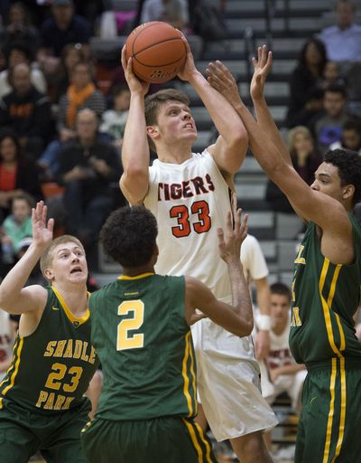 Lewis and Clark’s Vaughnden Handel  looks for a shot against Shadle Park’s defense on Friday. (Colin Mulvany / The Spokesman-Review)
