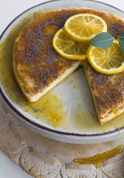 In much of the world, Hanukkah is celebrated by eating salty cheeses. This Roman cheesecake with orange-scented honey can be made for this tradition. (Associated Press)