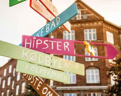 A collection of signs in Copenhagen, Denmark, includes a sign for 