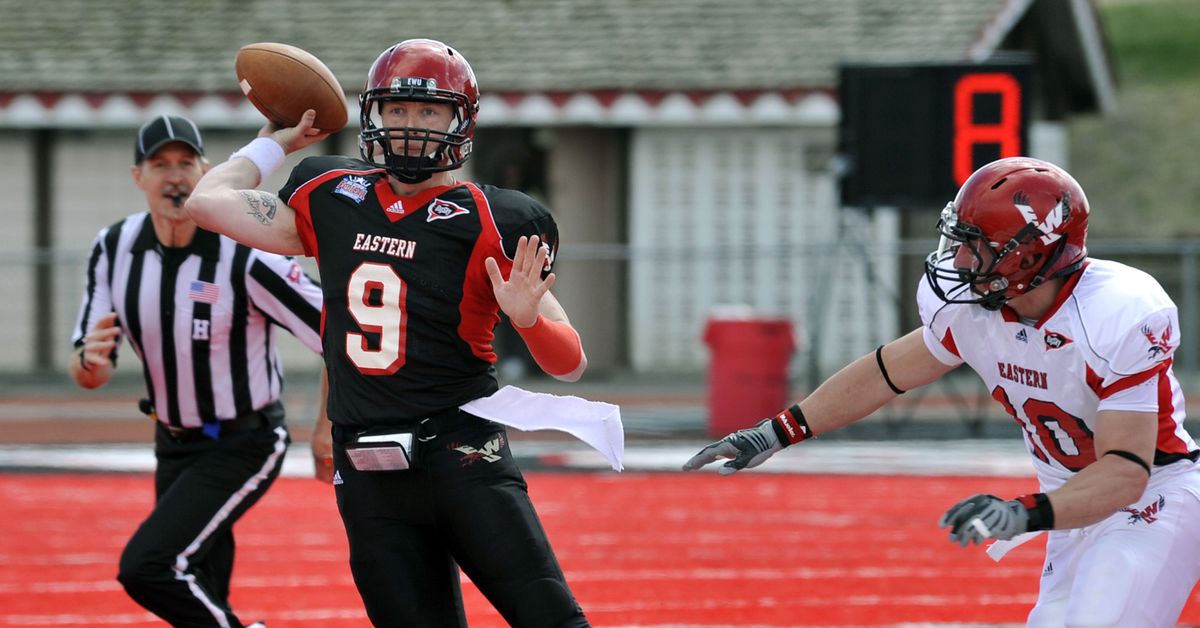 Eastern Washington University QB Bo Levi Mitchell fires a pass under pressure from LB Zach Johnson in the first quarter during the Eagles' 2011 Red-White  football game at Roos Field in Cheney, Wash. (Dan Pelle / The Spokesman-Review)
