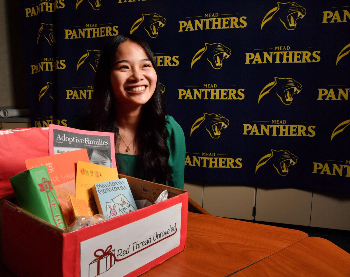 Mead High School student Zoe Sponseller, 17, recently won a business award from a WSU business plan competition of $5,000 for her project Red Thread Unraveled. Sponseller is pictured here on May 13 with a prototype of one of her planned boxes to be sent to Chinese adoptees with the goal of strengthening and maintaining the recipient’s cultural connection to China.  (Tyler Tjomsland/The Spokesman-Review)