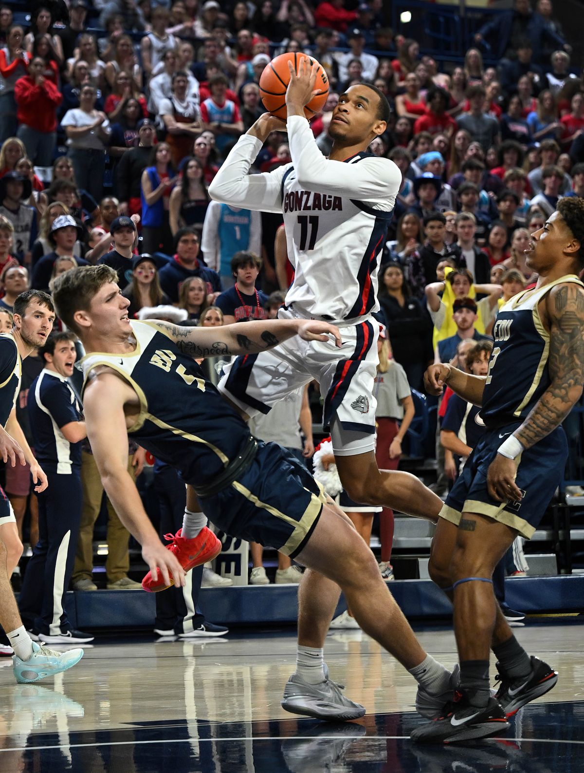 Gonzaga guard Nolan Hickman fights through the defense of Eastern Oregon forward Preston Chandler as he heads to the basket during the first half of Tuesday’s contest at McCarthey Athletic Center.  (COLIN MULVANY/THE SPOKESMAN-REVIEW)