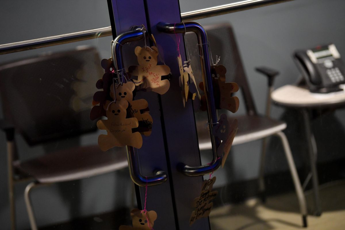 Protesters hung cutout teddy bears with individual handwritten messages on the doors of Spokane's Department of Homeland Security's offices on Friday, July 12, 2019, in Spokane, Wash. Tyler Tjomsland/THE SPOKESMAN-REVIEW (Tyler Tjomsland / The Spokesman-Review)
