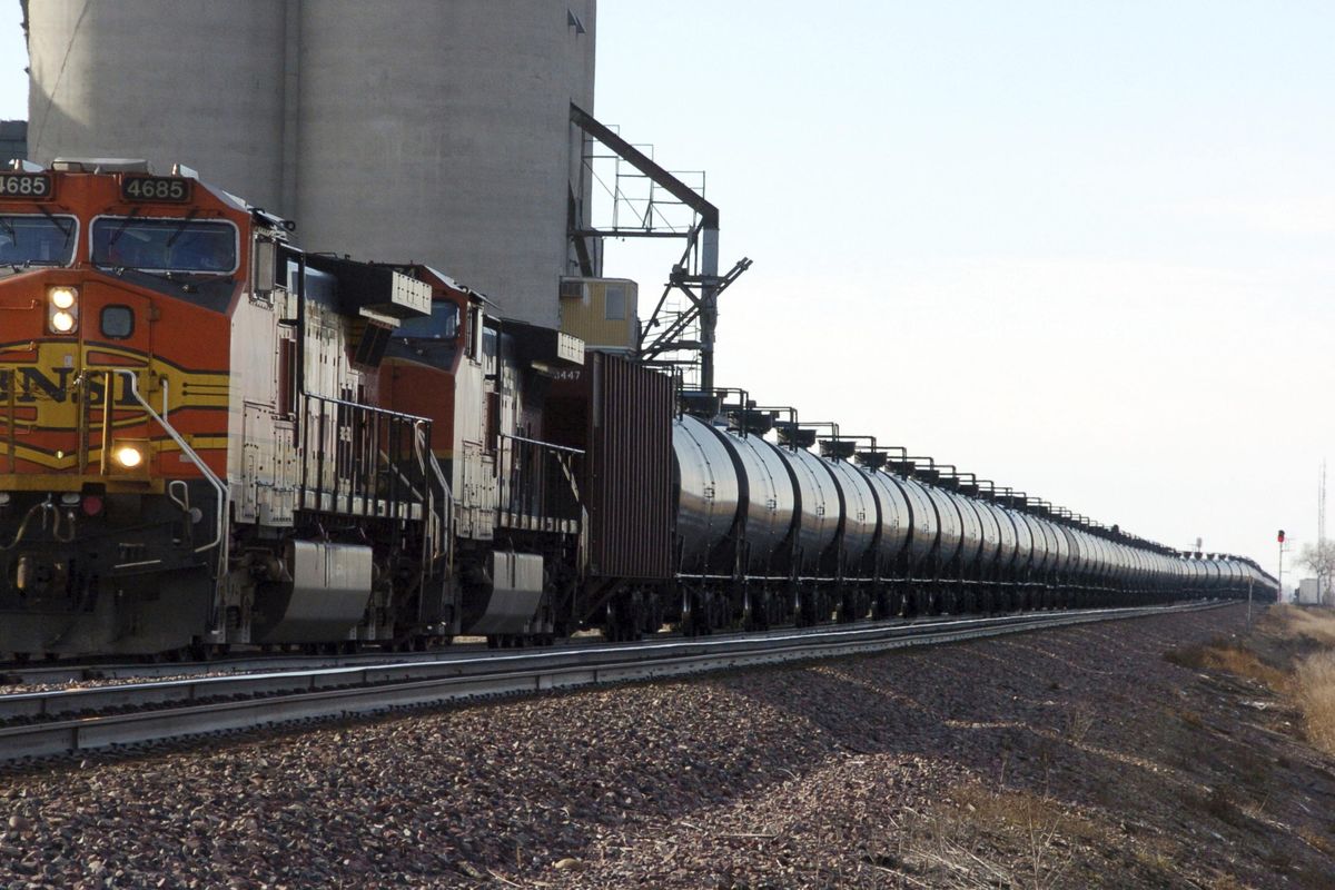 In  a Nov. 6, 2013,  photo, a BNSF Railway train hauls crude oil near Wolf Point, Mont. The Trump administration vastly understated the potential benefits of installing more advanced brakes on trains that haul explosive fuels when it cancelled a requirement for railroads to begin using the equipment, the Associated Press has found. A government analysis used by the administration to justify the cancellation omitted up to $117 million in potential reduced damages from using electronic brakes. Department of Transportation officials acknowledged the error after it was discovered by the Associated Press during a review of federal documents but said it would not have changed their decision. (Matthew Brown / Associated Press)