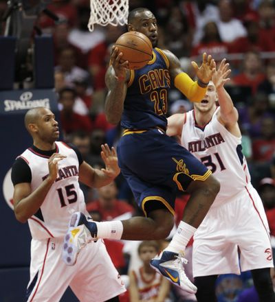 Cleveland forward LeBron James had 31 points, eight rebounds and six assists as Cavaliers held off Atlanta for a 97-89 victory. (Associated Press)