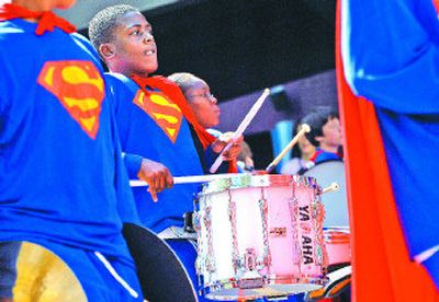 
Chase Middle School seventh-grader Deandré Solomon concentrates while he keeps the beat with his drum  during the Junior Lilac Parade in Spokane on Saturday. 
 (Holly Pickett / The Spokesman-Review)