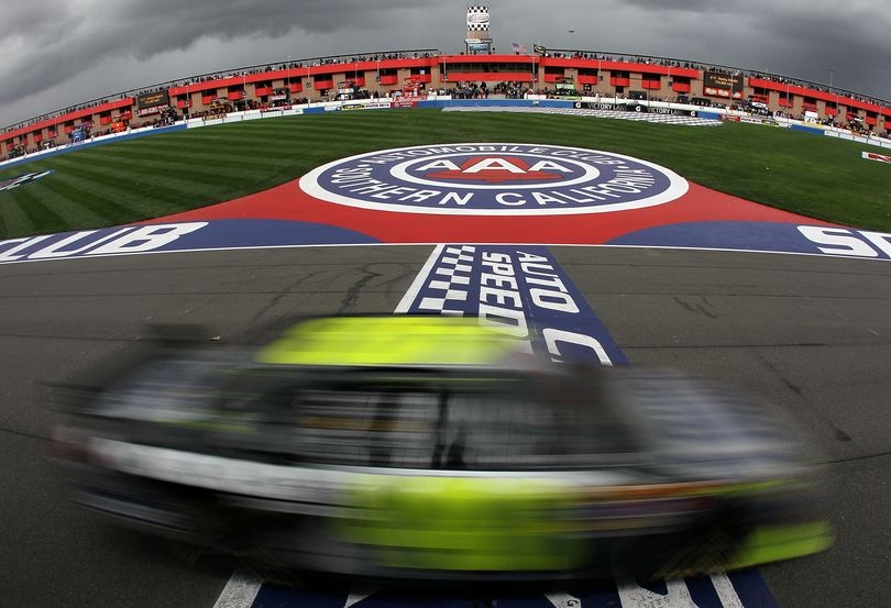 Earning his fifth victory at Auto Club Speedway, Jimmie Johnson crosses the finish line in the No. 48 Lowe's/Kobalt Tools Chevrolet during the NASCAR Sprint Cup Series Auto Club 500. (Photo courtesy of Jeff Gross/Getty Images for NASCAR)
