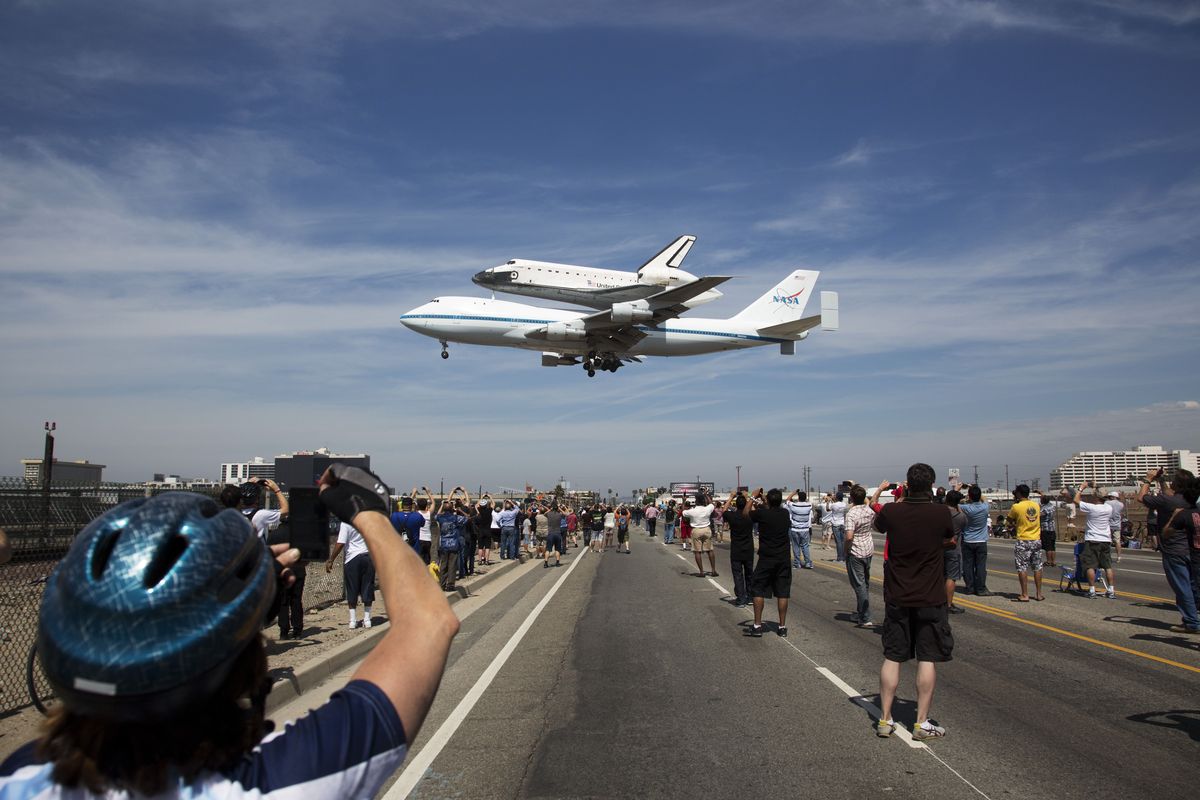 In this photo provided by NASA, the Space Shuttle Endeavour atop a modified 747 lands at Los Angeles International Airport on Friday, Sept. 21, 2012 in Los Angeles. Endeavour will be permanently displayed at the California Science Center in Los Angeles. (Matt Hedges / Nasa)