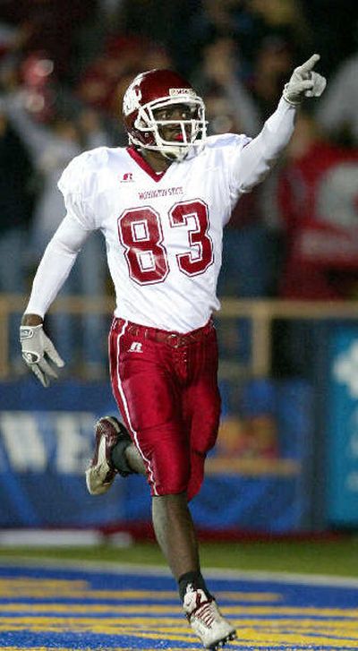 
Jason Hill celebrates a touchdown catch in the third quarter. 
 (Associated Press / The Spokesman-Review)