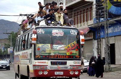 Residents sit on the roof of a bus Tuesday to flee Mingaora, a town in Pakistan’s Swat Valley.  Residents left as a peace deal between militants and Pakistan’s government crumbled.  (Associated Press / The Spokesman-Review)