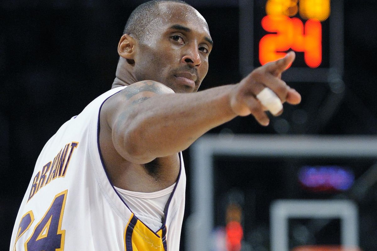 In this June 7, 2009 file photo Los Angeles Lakers guard Kobe Bryant (24) points to a player behind him after making a basket in the closing seconds against the Orlando Magic in Game 2 of the NBA basketball finals in Los Angeles. Bryant, the 18-time NBA All-Star who won five championships and became one of the greatest basketball players of his generation during a 20-year career with the Los Angeles Lakers, died in a helicopter crash Sunday, Jan. 26, 2020. He was 41. (Mark J. Terrill / AP)