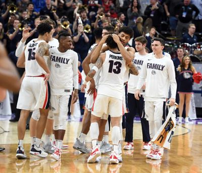 Gonzaga players celebrate their 83-71 victory against Baylor during the second round of the NCAA Tournament on Saturday, March 23, 2019, in Salt Lake City. (Colin Mulvany / The Spokesman-Review)