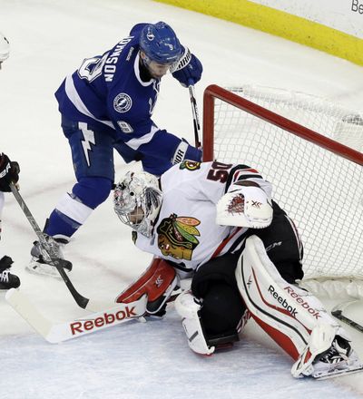 Lightning’s Tyler Johnson scores past Corey Crawford in the second period. (Associated Press)