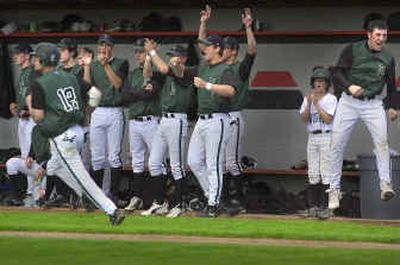 
The East Valley dugout reacts as George Hamilton (12) singles in the winning run in the top of the seventh inning against West Valley. The Knights advanced to state with the win.
 (Christopher Anderson / The Spokesman-Review)