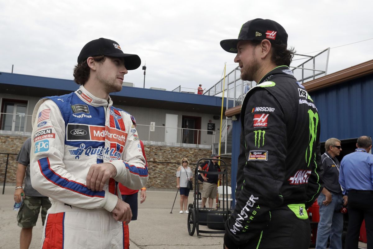 Ryan Blaney, left, talks with Kurt Busch before a practice session, Saturday, June 17, 2017, for the NASCAR Sprint Cup series auto race in Brooklyn, Mich. (Carlos Osorio / Associated Press)