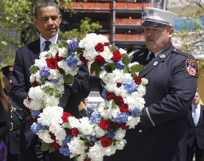 President Barack Obama lays a wreath at ground zero in New York on Thursday. (Associated Press)