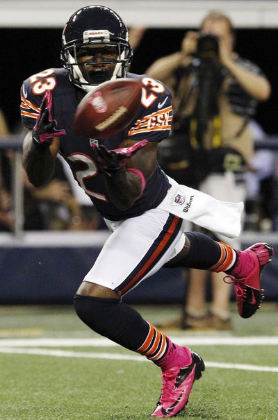Devin Hester hauls in a second-half TD pass for Chicago. (Associated Press)