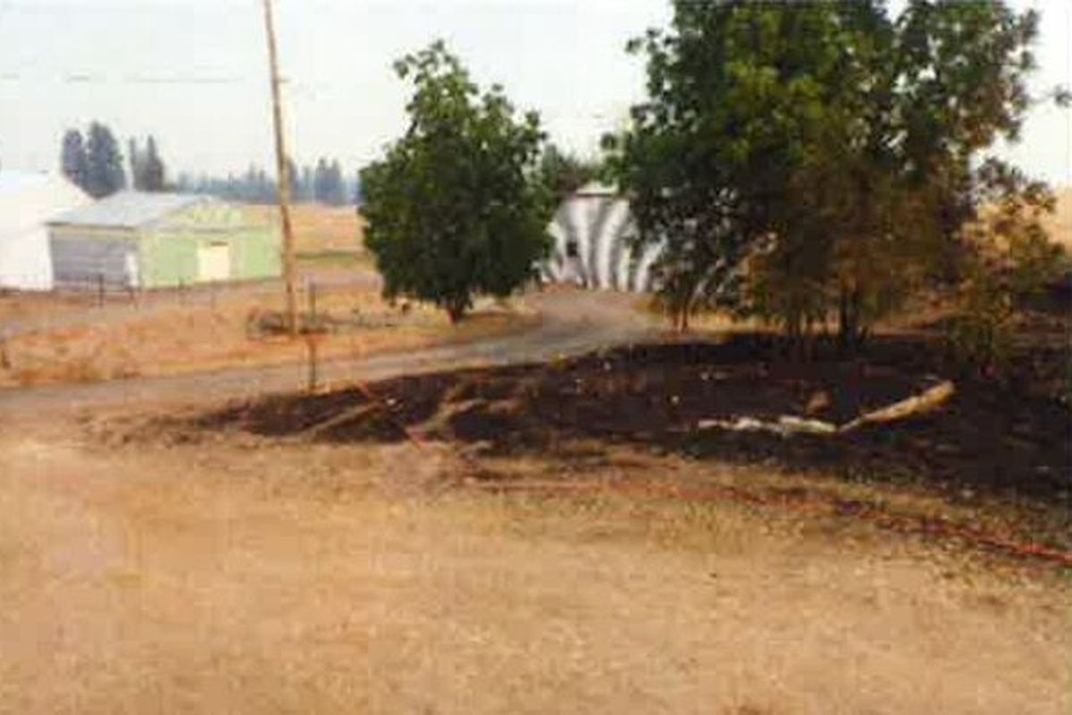 This photo taken by Washington State Department of Natural Resources investigators shows where the Gray fire started. A DNR investigation found the fire was caused by sparks coming from an Inland Power and Light security light.  (Washington Department of Natural Resources Gray Fire report)