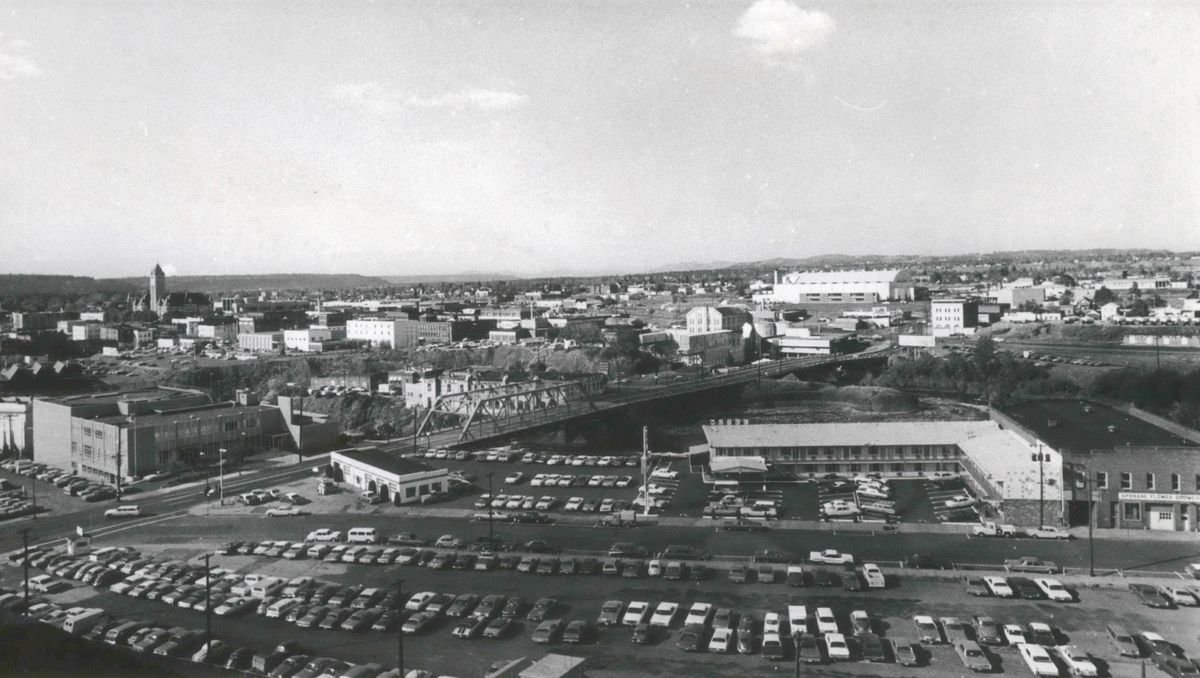 1971 - Just a few years before Expo ’74, Havermale Island is poised to change dramatically. The Travelodge motel on the lower right, and the large parking lots will have to go away for the transformation. Perhaps the largest change will be a tunnel over Washington Street and the mound of earth that will cover it so that visitors won’t have to cross a street as they walk the island. (SPOKESMAN-REVIEW PHOTO ARCHIVE / SR)