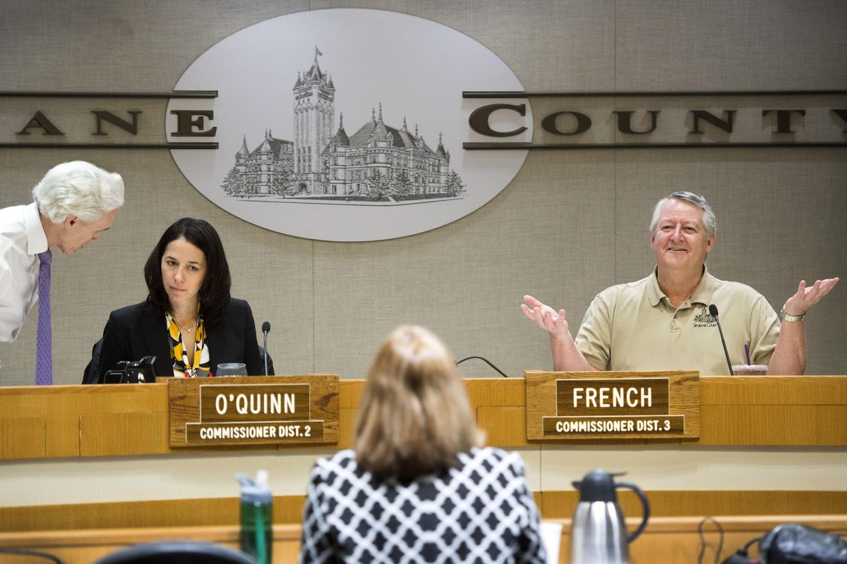 Spokane County Commissioner Al French, right, converses with commission candidate Nancy McLaughlin, Feb. 22, 2016, before the start of the interview process to replace Todd Mielke. At left, Spokane County Attorney Jim Emacio meets with Commissioner Shelly O’Quinn. Josh Kerns and Jeff Baxter were also interviewed in the Public Works Building’s hearing room. (Dan Pelle / The Spokesman-Review)