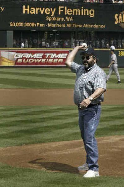
North Spokane resident Harvey Fleming was the Seattle Mariners' 50-millionth fan, so he threw the first pitch during a home game Aug. 14.
 (Ben Van Houten/Seattle Mariners / The Spokesman-Review)