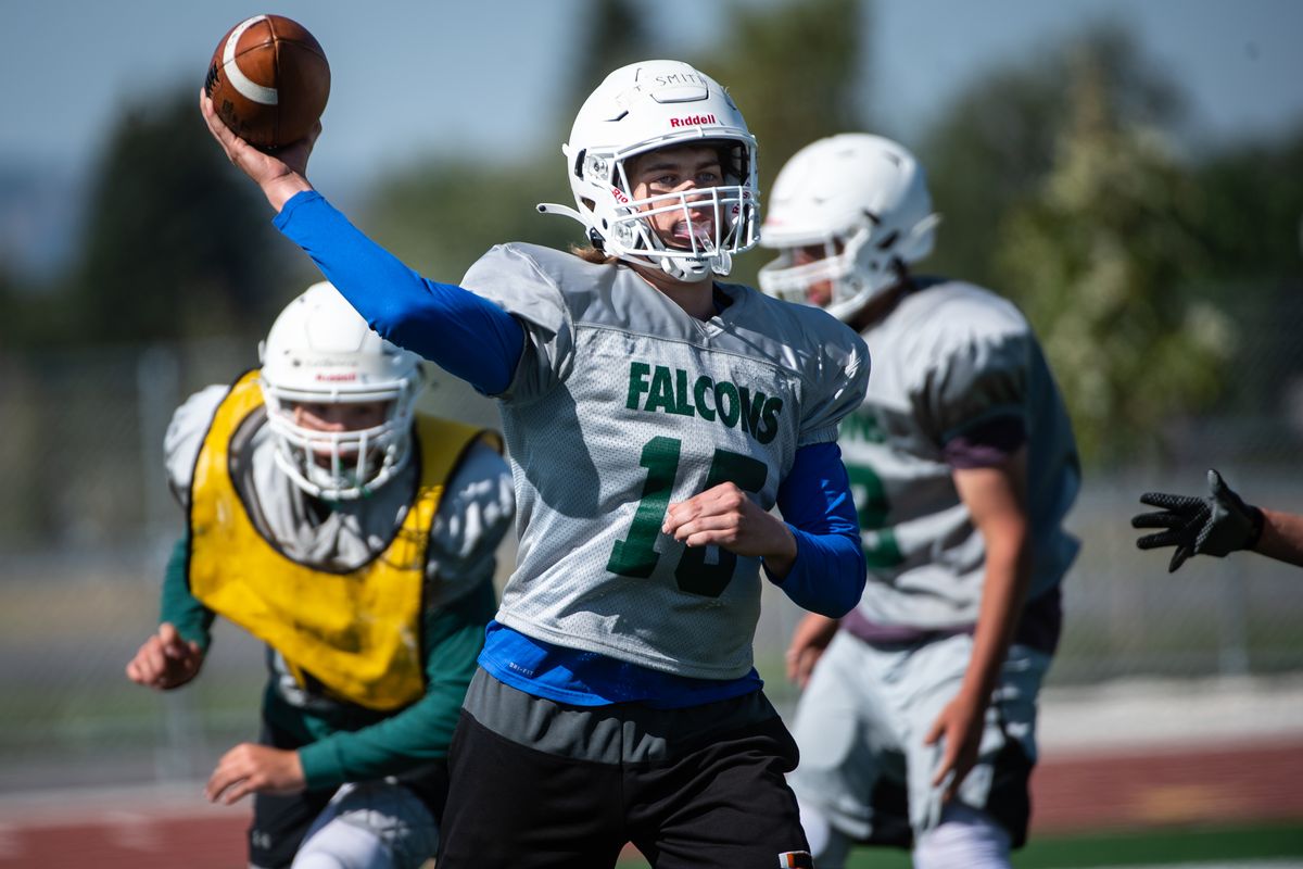 Sophomore quarterback Tanner Smith (15) throws a pass during practice. Ridgeline is the first new high school to open in the area in 20 years.  (Libby Kamrowski/THE SPOKESMAN-REVIEW)