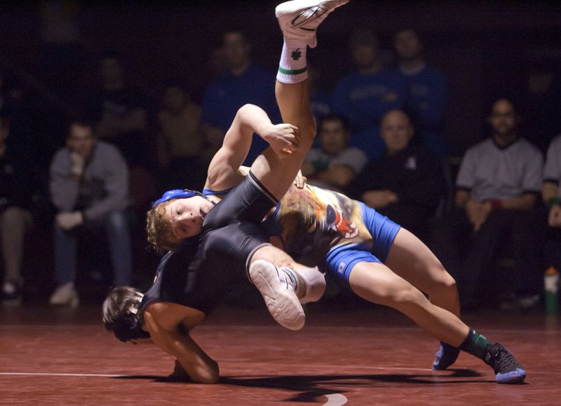 U-Hi’s  Tyler Clark, right, drives against Dalton Brady of Chandler (Ariz.)  at 112 pounds.  (Bruce Twitchell)