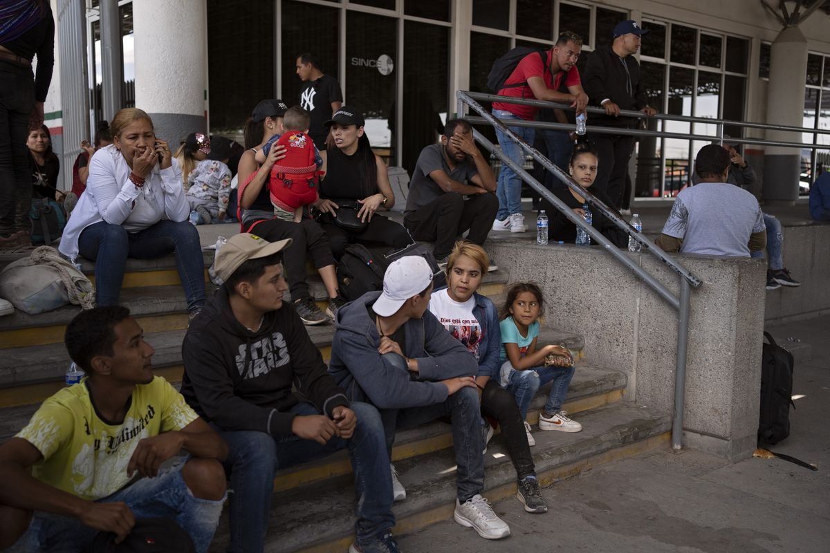 Migrants hoping to turn themselves in to seek asylum on May 13 in the U.S. in Ciudad Juárez, Mexico.  (Danielle Villasana/Washington Post)