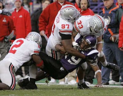 
OSU underclassmen Malcolm Jenkins (2) and James Laurinaitis (33) aim to send seniors such as David Patterson (97) out winners. 
 (Associated Press / The Spokesman-Review)