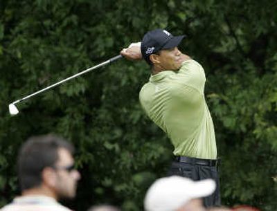 
Tiger Woods follows his tee shot on the 11th hole during second-round play at East Lake Golf Club in Atlanta. Associated Press
 (Associated Press / The Spokesman-Review)
