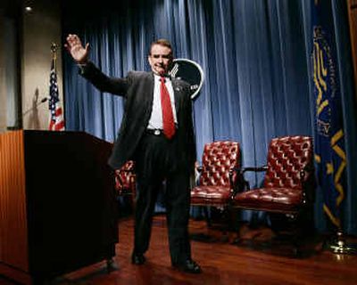 
Secretary of Health and Human Services Tommy Thompson waves farewell after announcing his resignation at HHS headquarters Friday in Washington.
 (Associated Press / The Spokesman-Review)