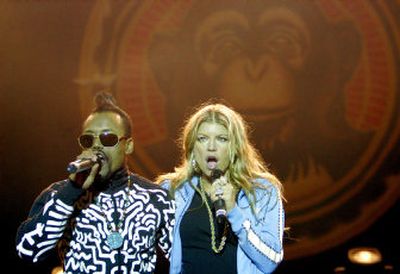 
Apl.de.ap and Fergie of The Black Eyed Peas perform in San Jose, Costa Rica, on Tuesday. The  group was a triple winner at the 2006 American Music Awards on Tuesday night. 
 (Associated Press / The Spokesman-Review)