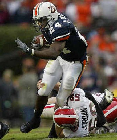 
Auburn's Carnell Williams (24) breaks away while returning a third-quarter punt. 
 (Associated Press / The Spokesman-Review)