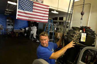 
Brent Harnack prepares to rig a boat with a new motor and propeller at his North side business, H & S Marine Service. The Spokane Valley resident has had the business for 14 years. 
 (Holly Pickett / The Spokesman-Review)