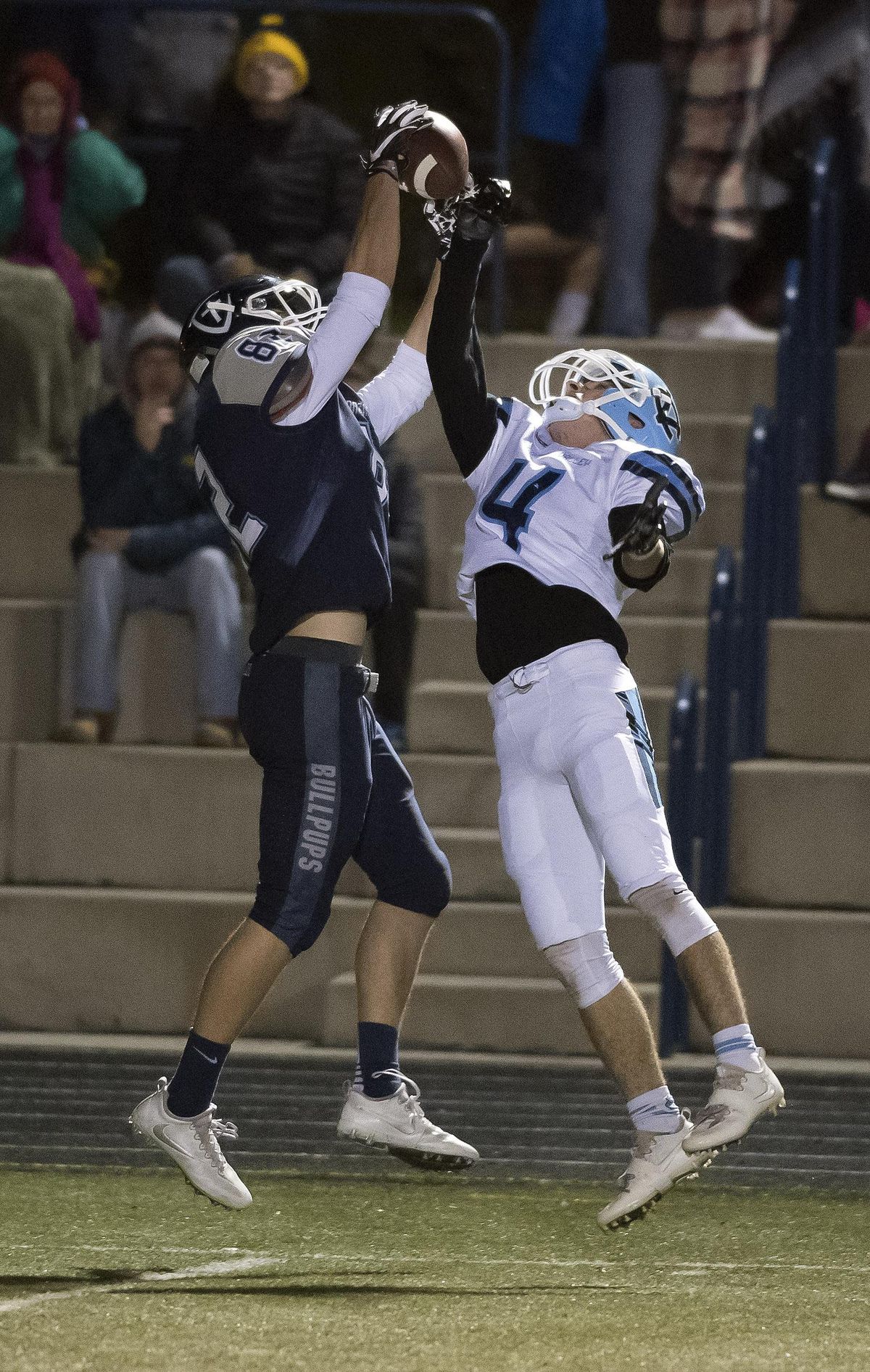 Gonzaga Prep wide receiver Tyler Bourn (82) hauls in a 30-yard pass over defender Central Valley's Jase McCammond (4) in the first half of a GSL high school football game, Fri., Oct. 28, 2016, at the Gonzaga Prep. (Colin Mulvany / The Spokesman-Review)