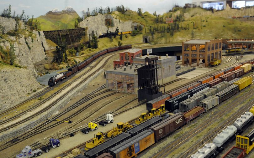 The Evergreen Railroad Modelers HO layout is built on a 25-foot-by-60-foot area with 18 bridges, a dozen tunnels, a large city and rail yard, three main lines, mountains, small towns and a computer system that allows the operator to run the trains with realistic sounds for steam and diesels.