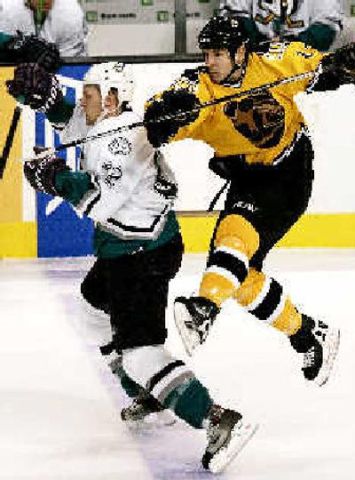 
Boston's Tom Fitzgerald, right, takes a run at Anaheim's Travis Moen during the first period. 
 (Associated Press / The Spokesman-Review)