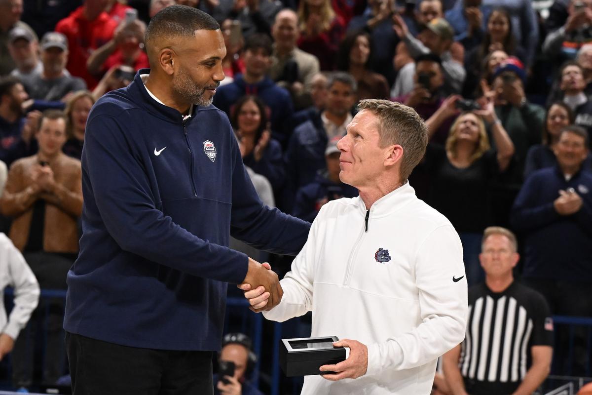 Gonzaga Bulldogs head coach Mark Few shakes hands with Grant Hill, who presented him with a ring for coaching the USA men’s Olympic Basketball team before the start of first half of a college basketball game against the San Francisco Dons on Thursday, Feb. 13, 2025, at McCarthey Athletic Center in Spokane, Wash.  (Tyler Tjomsland / The Spokesman-Review)