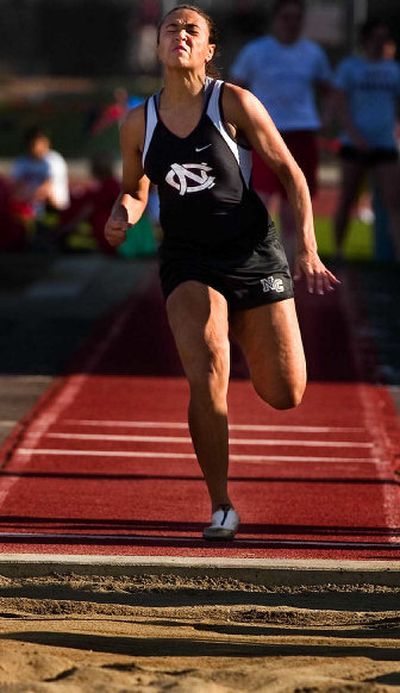 
North Central's Mallorie Frieske steamed toward a personal-record 16 feet, 5 inches in the long jump. 
 (Kathryn Stevens / The Spokesman-Review)