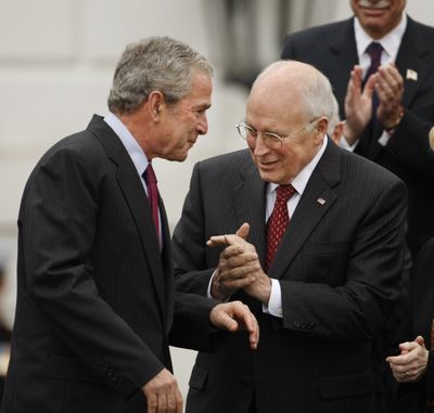 Vice President Dick Cheney applauds President Bush, after the president announced the staffing transition  Thursday.  (Associated Press / The Spokesman-Review)