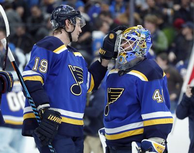 St. Louis’ Jay Bouwmeester and goaltender Carter Hutton celebrate after defeating Vegas 2-1 on Thursday night. (Jeff Roberson / Associated Press)