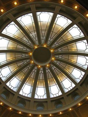 Afternoon light on a snowy day shines through the dome of the Idaho House chamber as lawmakers take back up their debate Thursday on HB 563, legislation to give top earners and corporations a $35.7 million tax cut. (Betsy Russell)