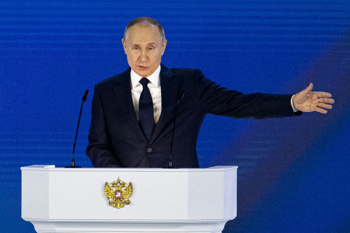 Russian President Vladimir Putin gestures as he gives his annual state of the nation address in Manezh, Moscow, Russia, Wednesday, April 21, 2021. Putin